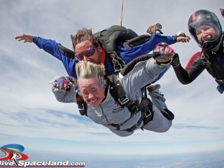 Houston mayor Annise Parker skydiving with instructor Hank Prewitt and Helaine Rumaner